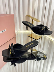MIUMIU 26S MULE SANDALS 55MM IN BLACK SUEDE WITH BOW