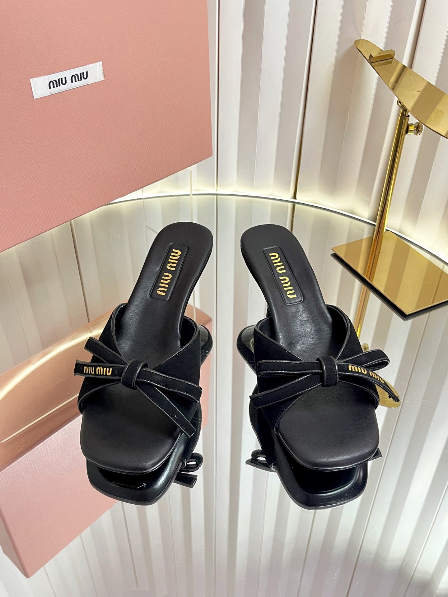 MIUMIU 26S MULE SANDALS 55MM IN BLACK SUEDE WITH BOW