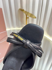 MIUMIU 26S MULE SANDALS 55MM IN BLACK CALFSKIN WITH BOW