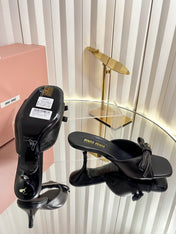MIUMIU 26S MULE SANDALS 55MM IN BLACK CALFSKIN WITH BOW