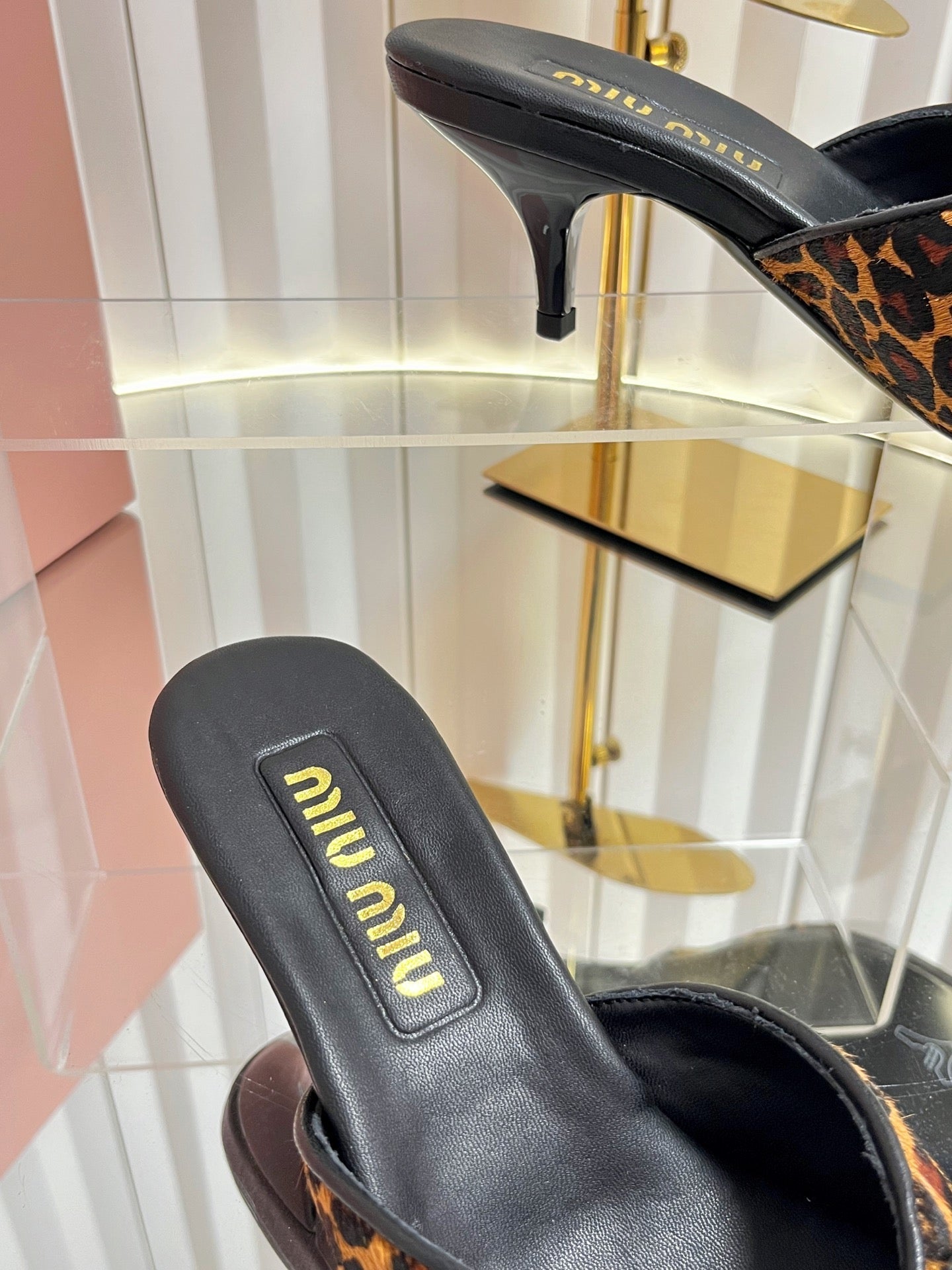 MIUMIU 26S MULE SANDALS 55MM IN LEOPARD PRINT CALF HAIR WITH BOW