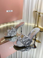 MIUMIU 26S HIGH-HEEL MULE SANDALS 85MM IN SILVER CALFSKIN GOLD HARDWARE