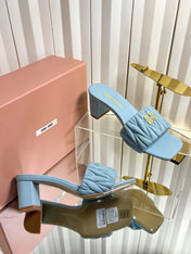 MIUMIU 26S PADDED MATELASSE MULE HEELS 65MM IN LIGHT BLUE CALFSKIN GOLD HARDWARE