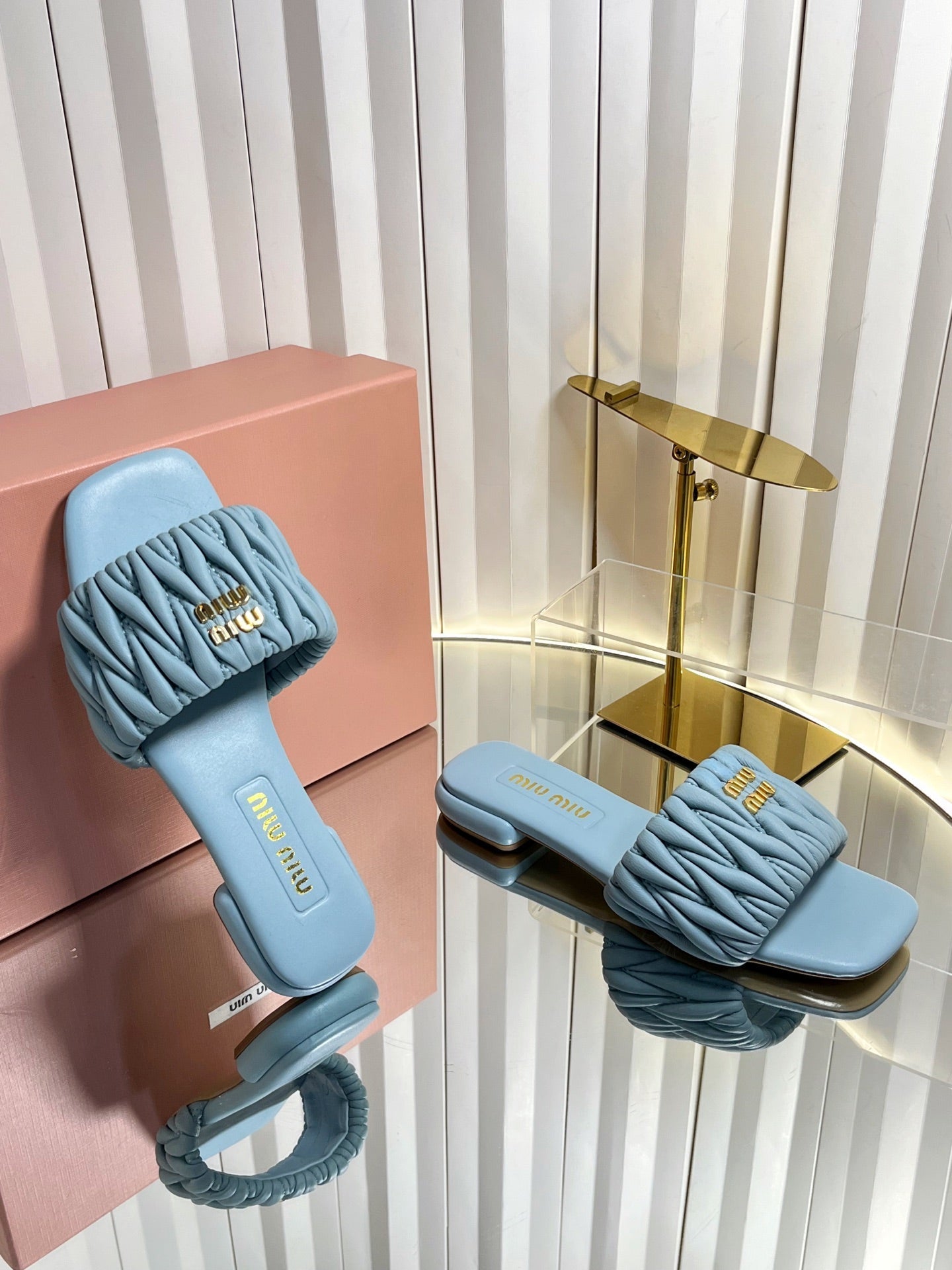 MIUMIU 26S MATELASSE SLIDES IN LIGHT BLUE CALFSKIN GOLD HARDWARE