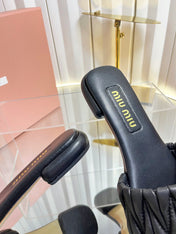 MIUMIU 26S MATELASSE SLIDES IN BLACK CALFSKIN GOLD HARDWARE