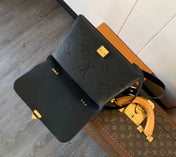 MADELEINE 30 IN BLACK MONOGRAM CALFSKIN EMBOSSED LOGO