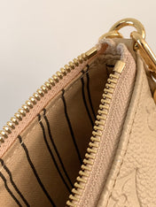 EASY POUCH ON STRAP 19 IN BEIGE MONOGRAM EMPREINTE LEATHER