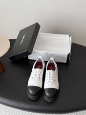 CHANEL 26S LACE UP PLATFORM IN BLACK AND WHITE CALFSKIN