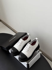 CHANEL 26S LACE UP PLATFORM IN BLACK AND WHITE CALFSKIN