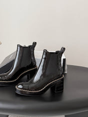 CHANEL 26S CHELSEA ANKLE BOOTS 70 MM IN BLACK EMBOSSED AND PATENT