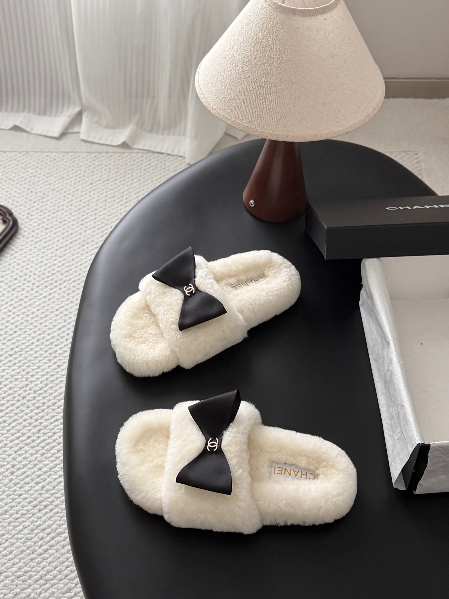 CHANEL 26S SLIDE SANDALS IN WHITE SHEARLING WITH BLACK BOW