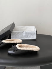 CHANEL 26S MULES IN BLACK LAMBSKIN AND SHEARLING