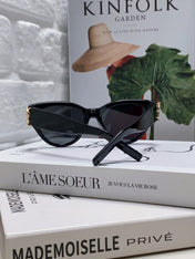 YSL CAT-EYE SUNGLASSES IN BLACK ACETATE WITH GOLD LOGO DETAIL