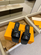 LV X TM 6AM FLAT MULE IN BLACK CALFSKIN