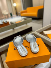 LV X TM 6AM FLAT MULE IN SILVER CALFSKIN