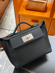 MINI 24/24 21CM IN BLACK EVERCOLOR CALFSKIN SILVER KELLY BUCKLE