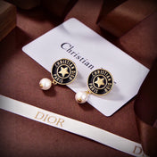 CD 26S STAR LOGO PEARL DROP EARRINGS IN GOLD TONE METAL 629949