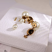 CD 26S CELESTIAL STAR PEARL DROP LOGO EARRINGS IN GOLD TONE METAL 629950