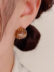 MIUMIU 26S MIU CRYSTAL LOGO STUD EARRINGS IN BROWN ENAMEL AND GOLD TONE METAL 633129