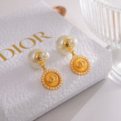 CD 26S DOUBLE PEARL MEDALLION LOGO DROP EARRINGS IN GOLD METAL
