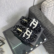 CHANEL 26S PLATFORM SLIDE SANDALS IN BLACK SHEARLING AND WHITE LOGO GG DALMATIAN PRINT