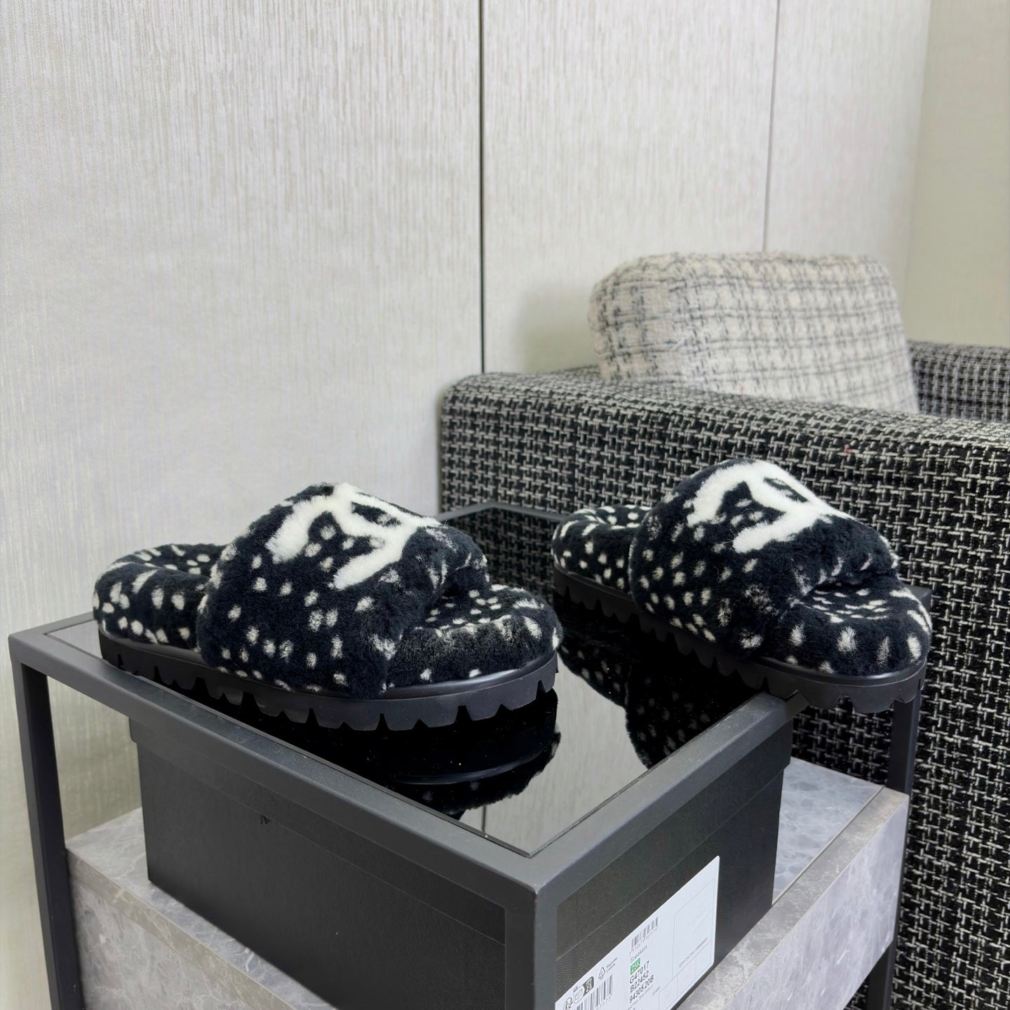 CHANEL 26S PLATFORM SLIDE SANDALS IN BLACK SHEARLING AND WHITE LOGO GG DALMATIAN PRINT