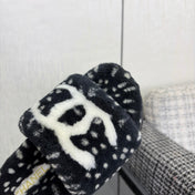 CHANEL 26S PLATFORM SLIDE SANDALS IN BLACK SHEARLING AND WHITE LOGO GG DALMATIAN PRINT