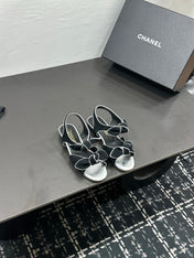 CHANEL 26S BOW SANDALS IN BLACK AND SILVER SUEDE