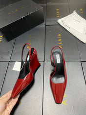 ALAIA 26S WEDGE SLINGBACKS 95 MM IN DARK RED PATENT CALFSKIN