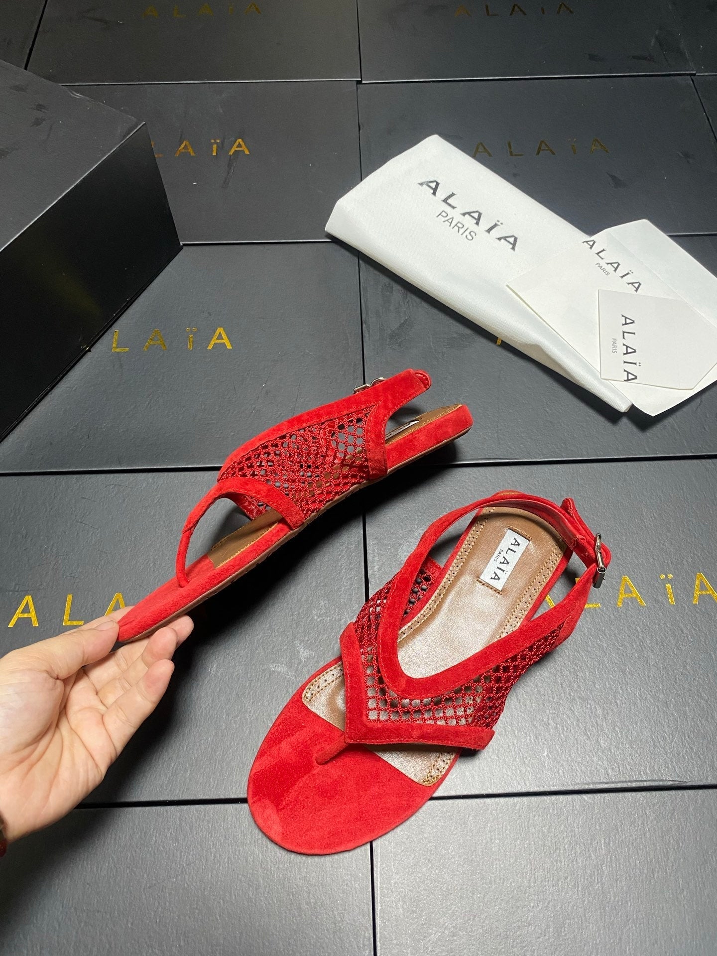 ALAIA 26S FLAT MESH THONG SANDALS IN RED SUEDE