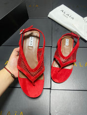 ALAIA 26S FLAT MESH THONG SANDALS IN RED SUEDE