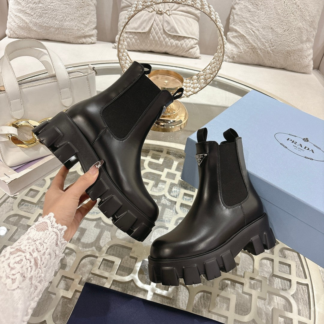 PRADA 26S MONOLITH CHELSEA BOOTS IN BLACK CALFSKIN AND FABRIC