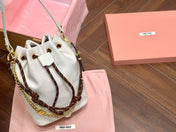 DRAWSTRING BUCKET BAG 21 IN WHITE CANVAS GOLD HARDWARE