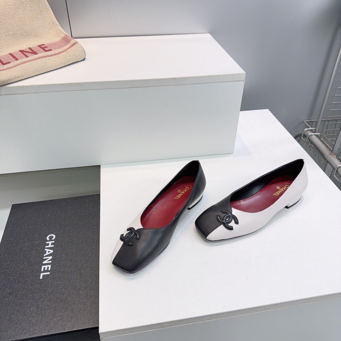 CHANEL 26S SQUARE-TOE FLATS IN BLACK AND WHITE LAMBSKIN