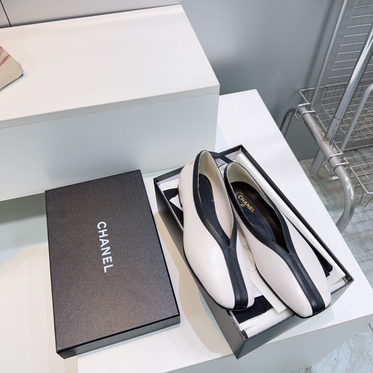 CHANEL 26S SQUARE-TOE FLATS IN WHITE LAMBSKIN WITH BLACK TRIM