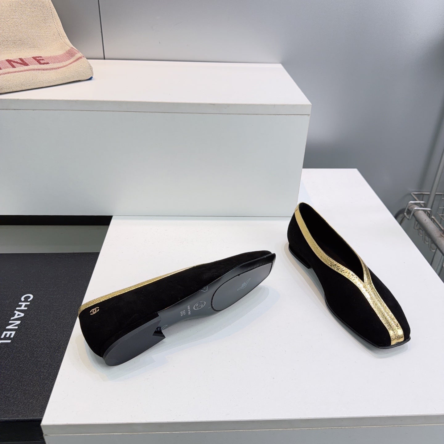 CHANEL 26S SQUARE-TOE FLATS IN BLACK SUEDE WITH GOLD PATENT TRIM