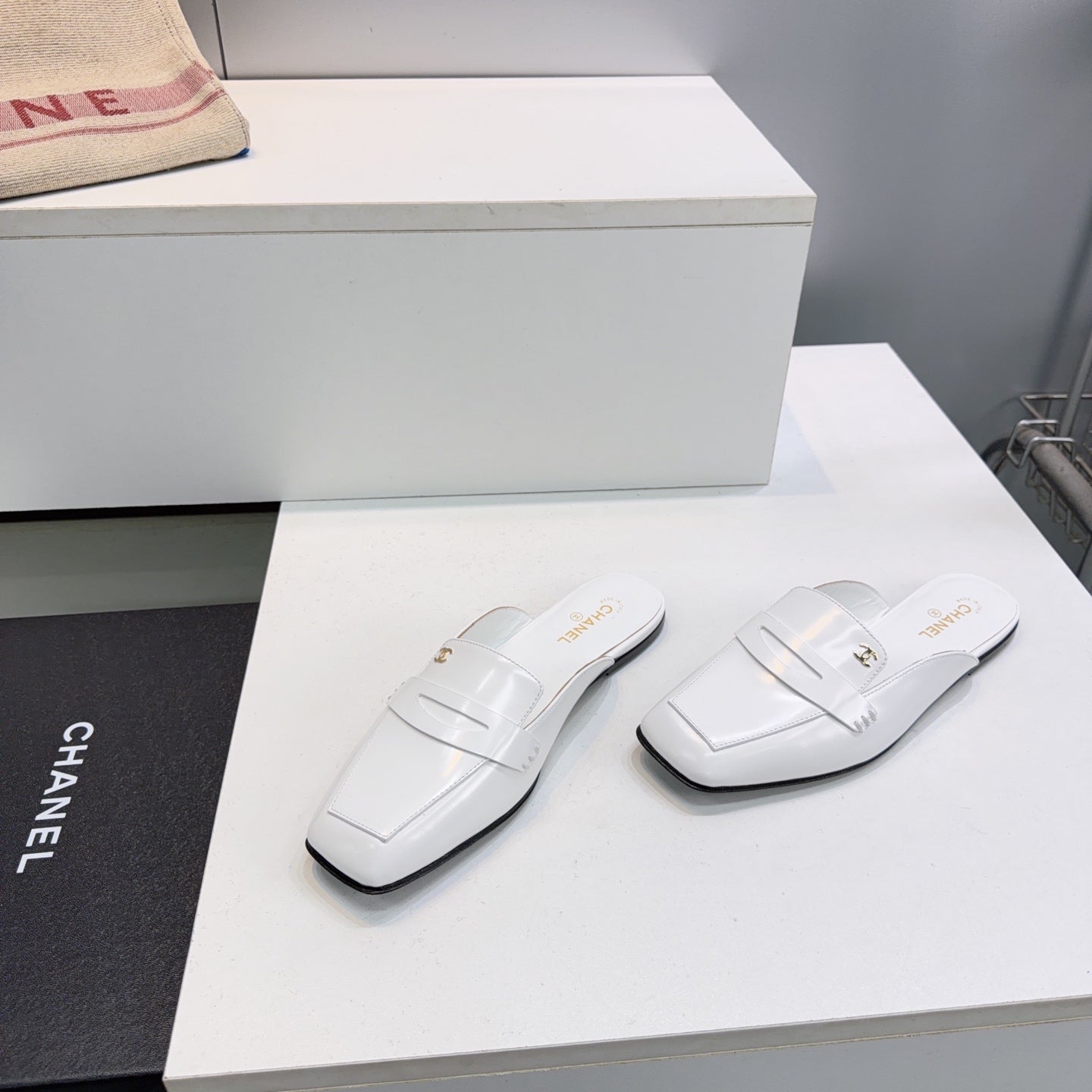 CHANEL 26S LOAFER MULES IN WHITE SHINY LAMBSKIN