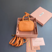 MICRO BAG KEYCHAIN 11 IN HOT CINNAMON ORANGE CALFSKIN EMBOSSED LOGO