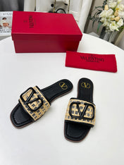 Vlogo embellished leather-trimmed raffia slides black