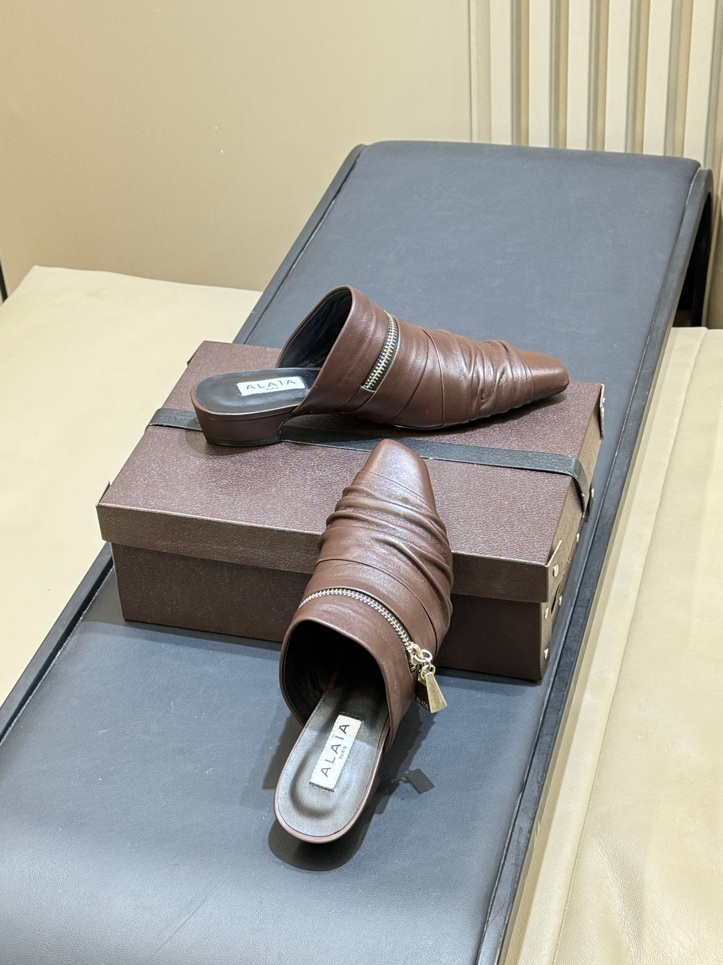 ALAIA 26S PLEATED MULES IN DARK BROWN LAMBSKIN