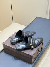 ALAIA 26S PLEATED MULES IN BLACK LAMBSKIN