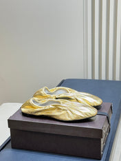 ALAIA 26S BALLET FLATS IN GOLD LAMBSKIN