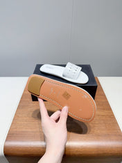 ALAIA FLAT SANDALS WITH PERFORATED STRAPS 25S IN WHITE LAMBSKIN