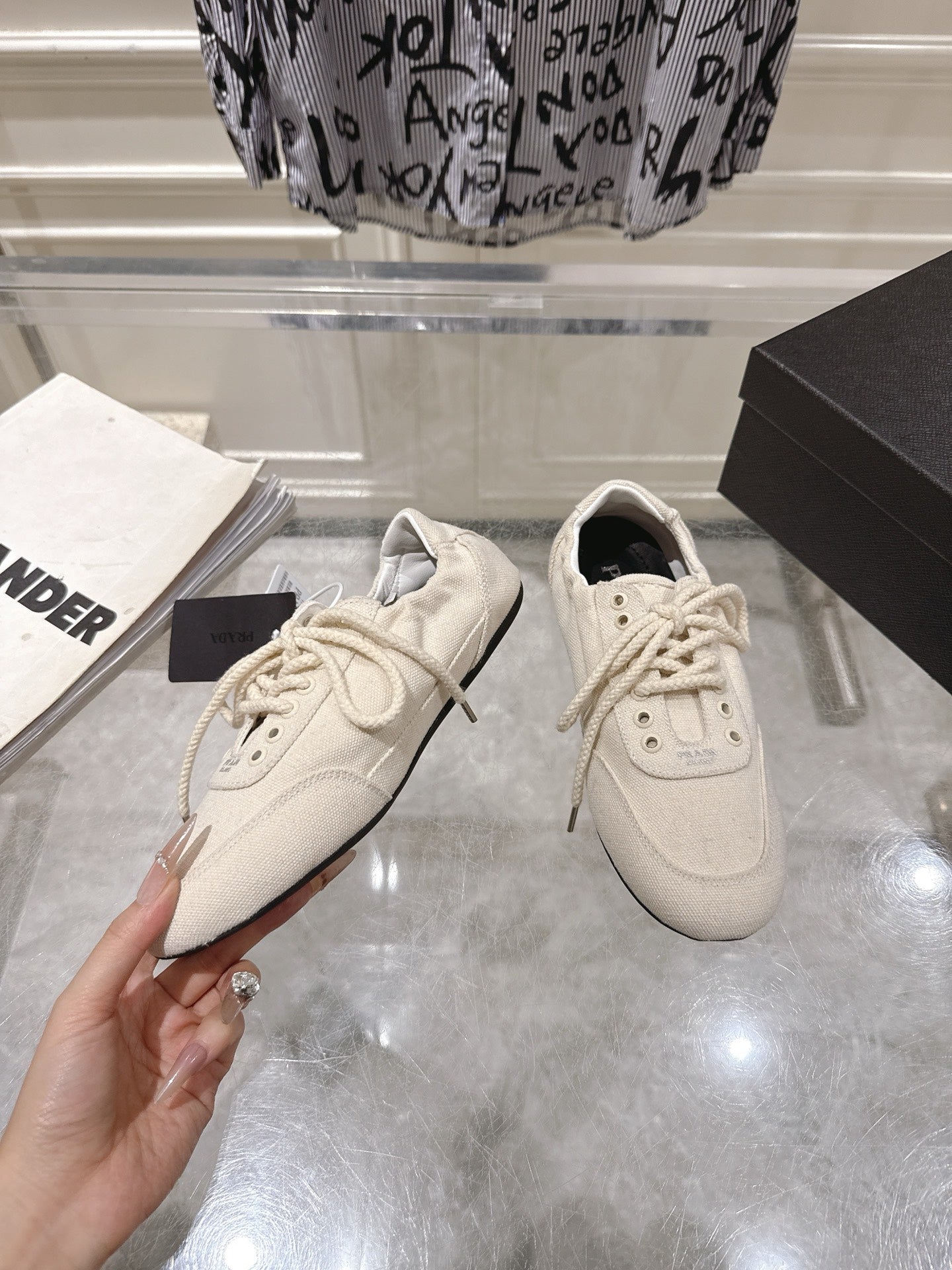 PRADA 26S COLLAPSE SNEAKERS IN WHITE CANVAS