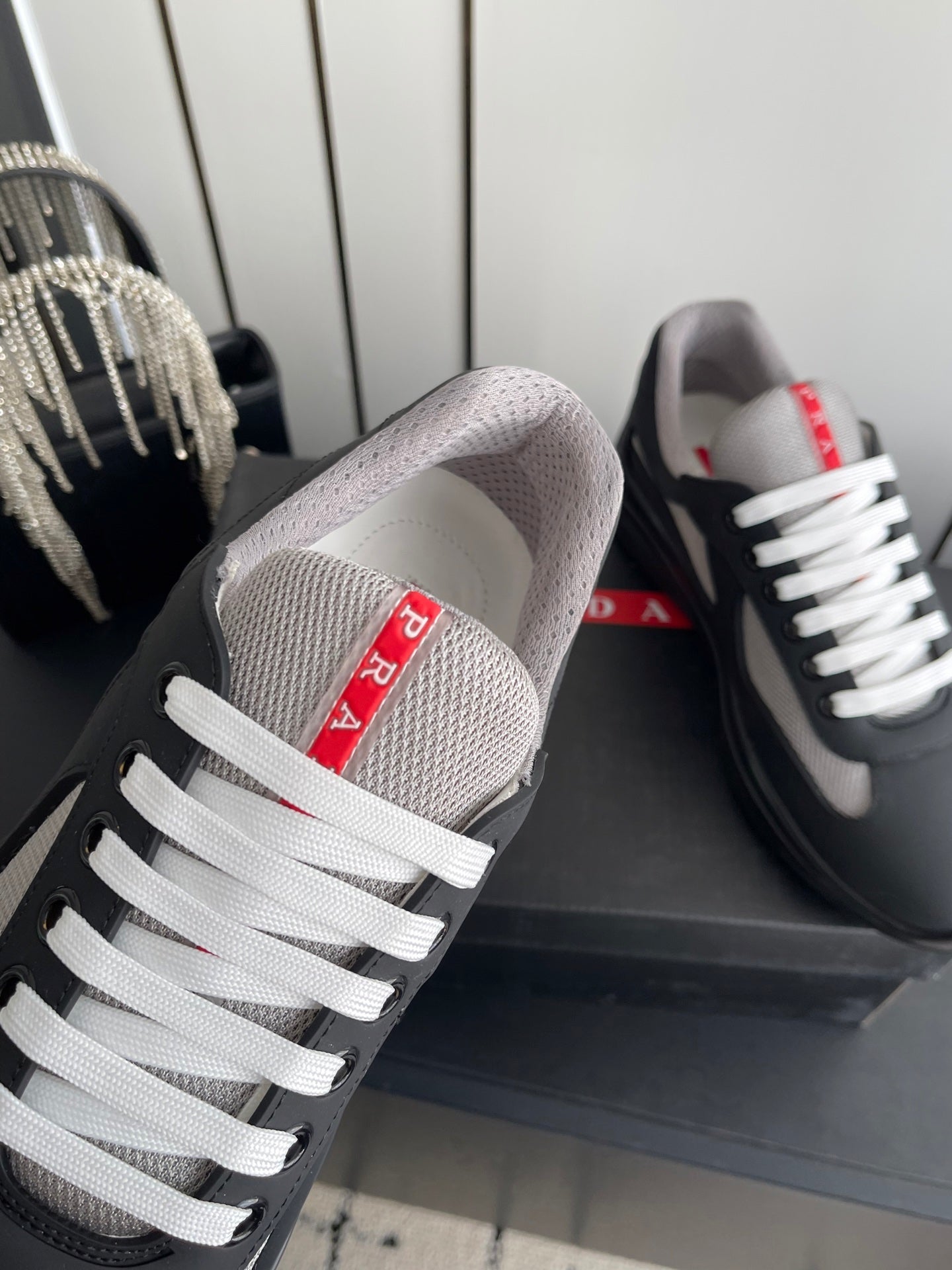 PRADA 26S AMERICA CUP SNEAKERS IN BLACK SOFT RUBBER AND BIKE FABRIC