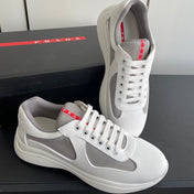 PRADA 26S AMERICA CUP SNEAKERS IN WHITE SOFT RUBBER AND BIKE FABRIC