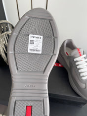 PRADA 26S AMERICA CUP SNEAKERS IN COOL GRAY SOFT RUBBER AND BIKE FABRIC