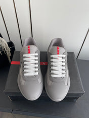 PRADA 26S AMERICA CUP SNEAKERS IN COOL GRAY SOFT RUBBER AND BIKE FABRIC