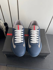 PRADA 26S AMERICA CUP SNEAKERS IN SLATE BLUE SOFT RUBBER AND BIKE FABRIC