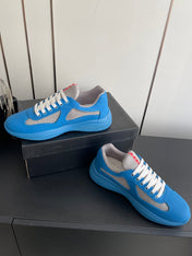 PRADA 26S AMERICA CUP SNEAKERS IN AZURE BLUE SOFT RUBBER AND BIKE FABRIC